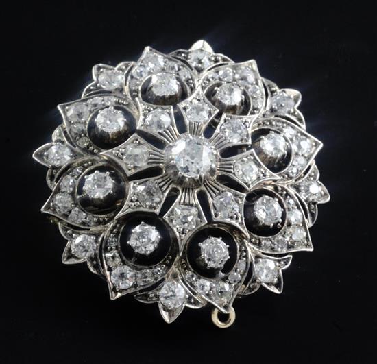 A Victorian gold, silver and diamond encrusted domed flowerhead pendant brooch, 1.5in.